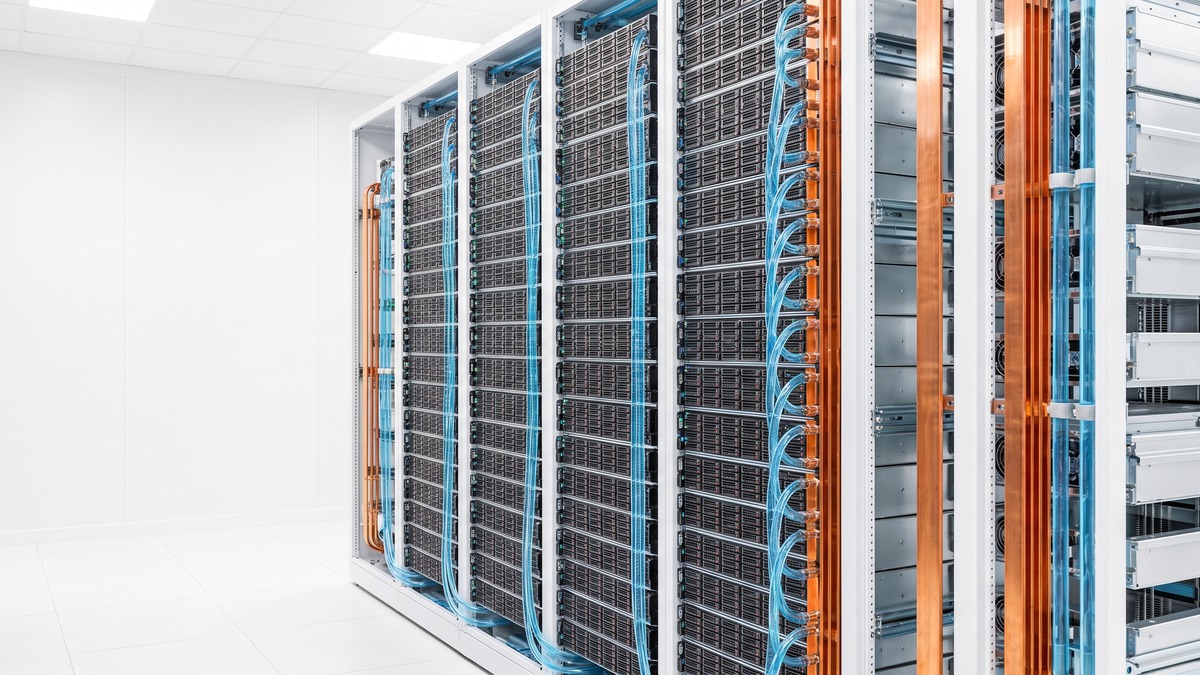A rack-scale liquid-cooled AI server system with NVLink coolant lines and busbar